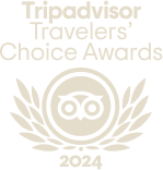 Logo del premio Travellers' Choice 2023 con icona di gufo e foglie stilizzate.